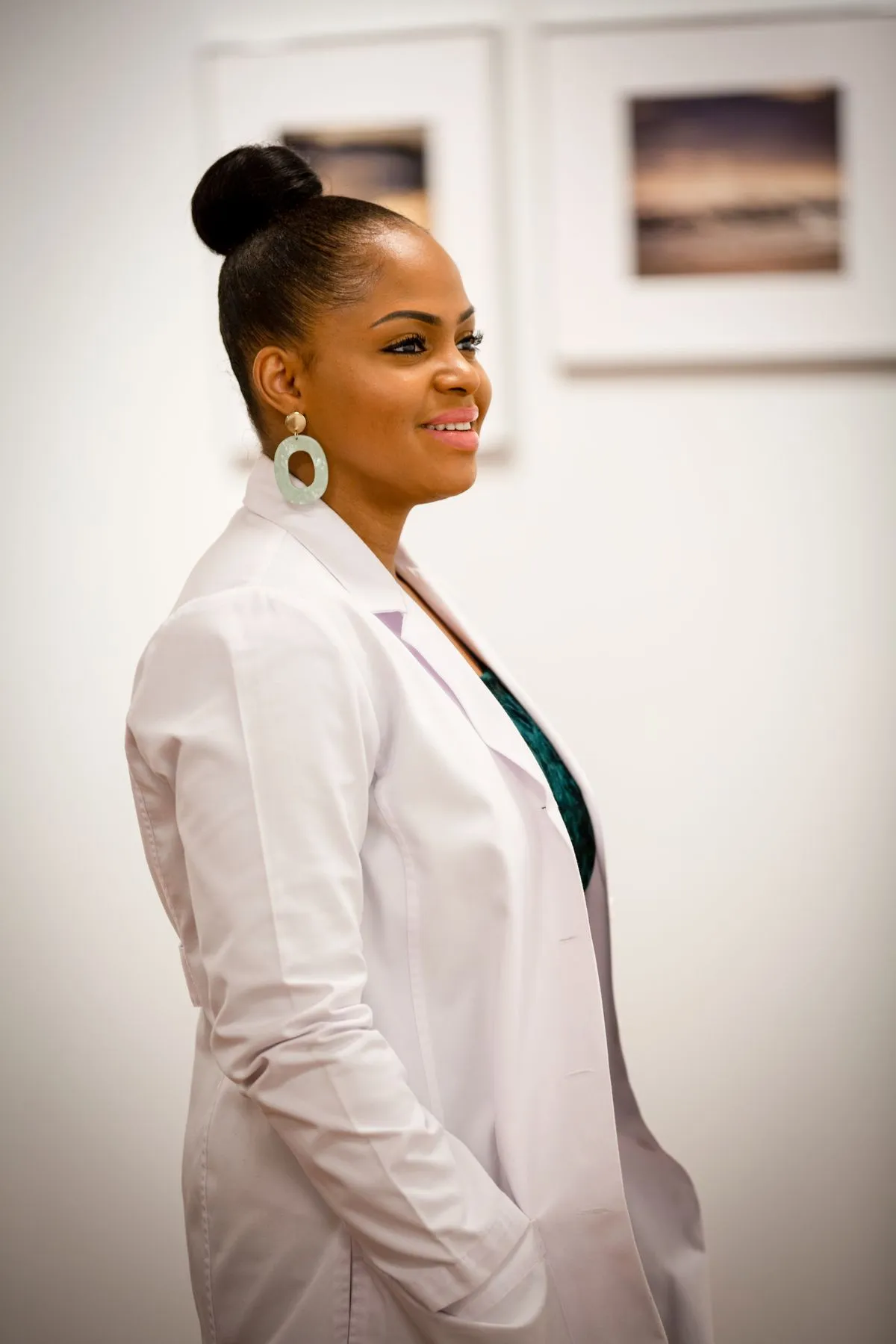 Portrait of Danielle, an aesthetic nurse in a white coat